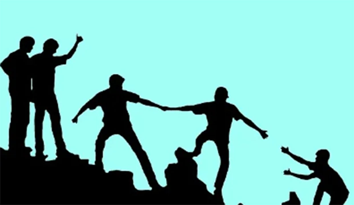 silhouette graphic of people working together to climb a mountain