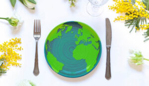 dinner place setting with a plate that is shaped like a globe